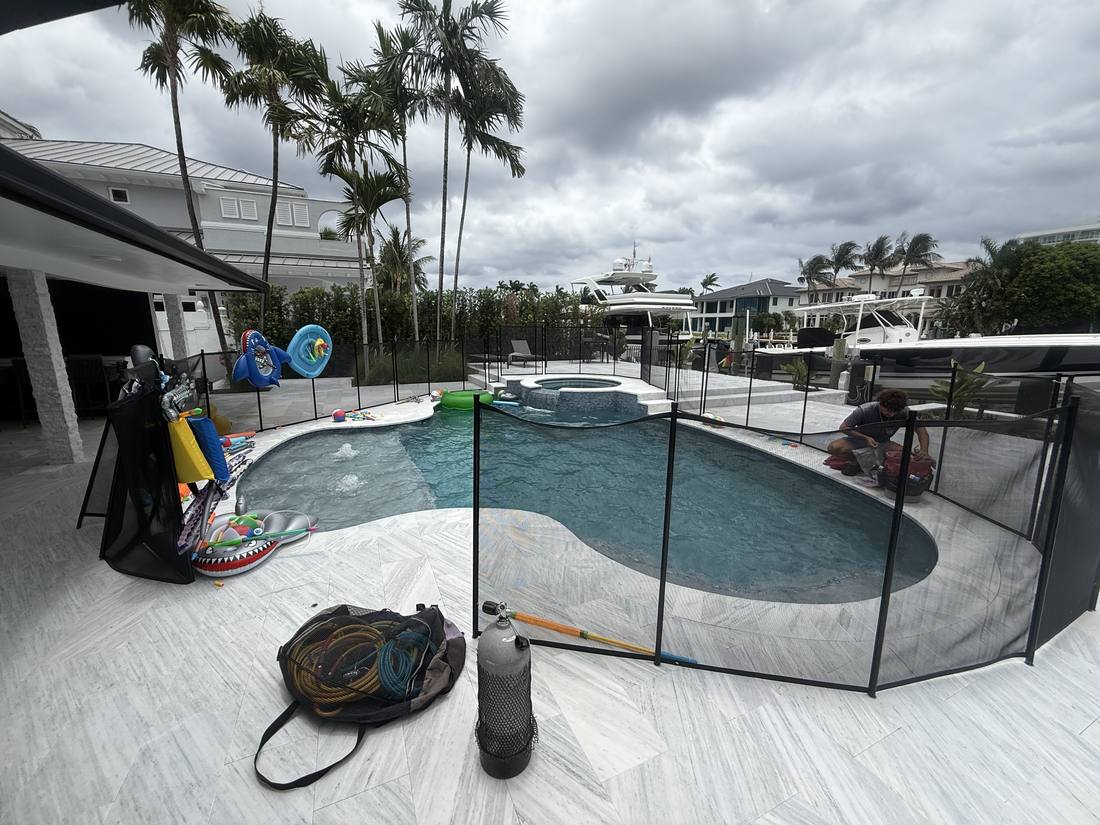 Canal-front pool in Fort Lauderdale, where a tidal water table and seawall conditions affect how a leak is found