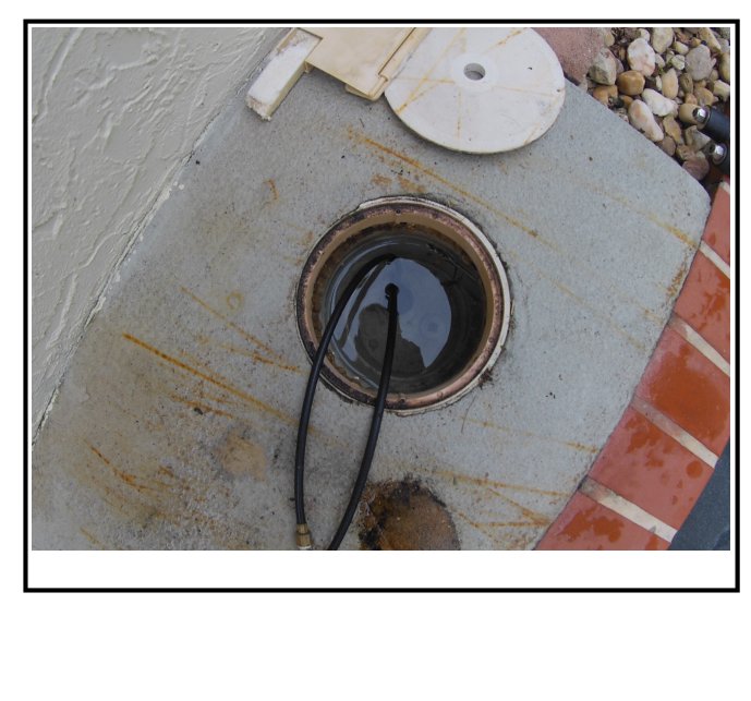 Skimmer housing with cover removed, showing the dye test line used to confirm a leak at the skimmer opening