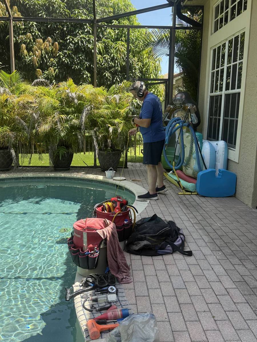 Diagnostic equipment set up at a Jupiter pool for a leak detection visit