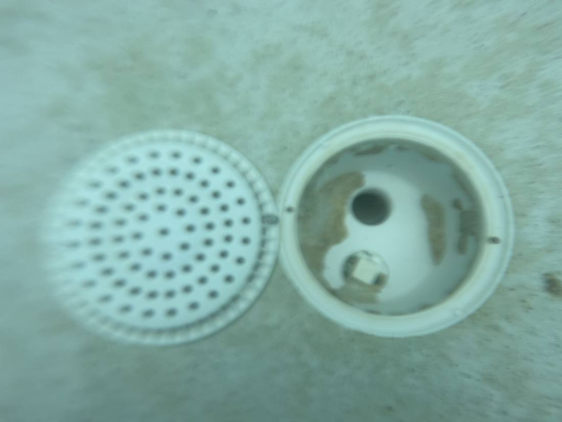 Main drain opened for inspection during a Lake Worth Beach pool leak evaluation