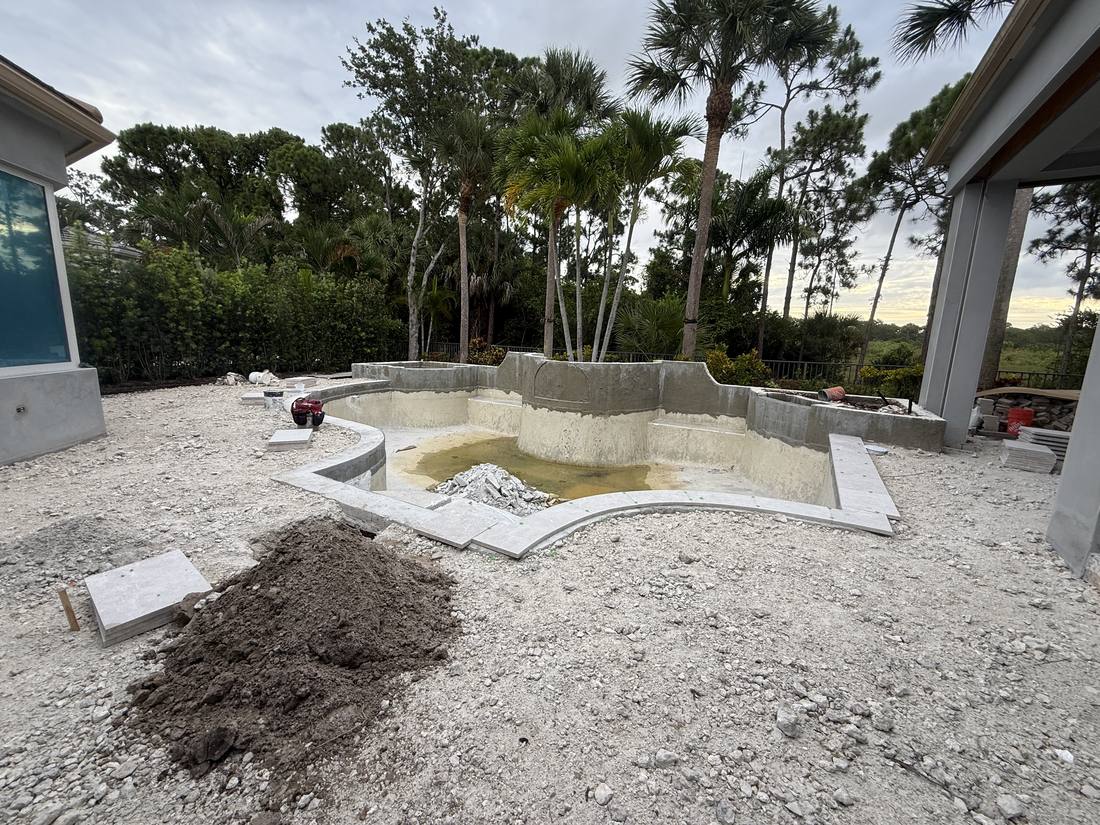 Drained pool shell during excavation at a Palm Beach Gardens home