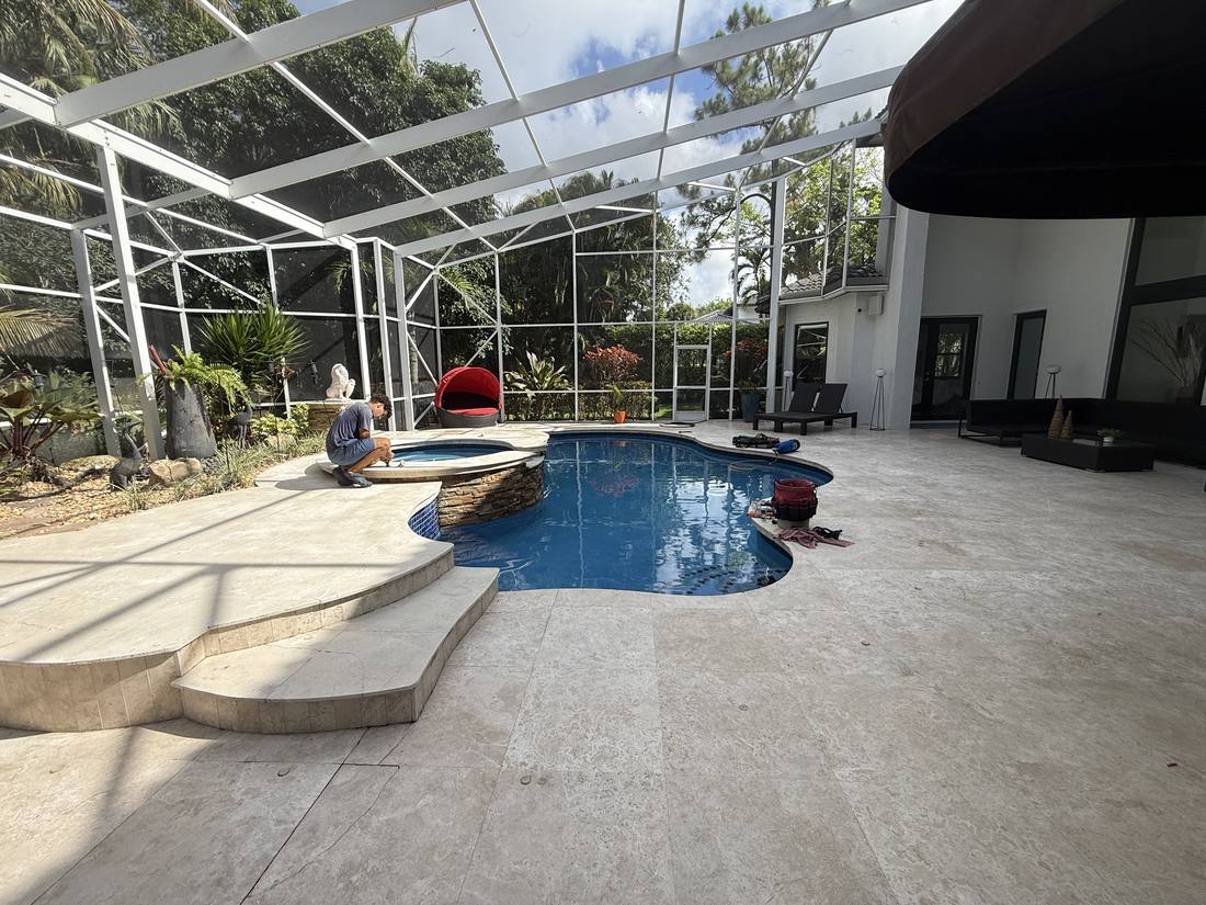 Screen-enclosed pool in Pompano Beach during a leak detection visit