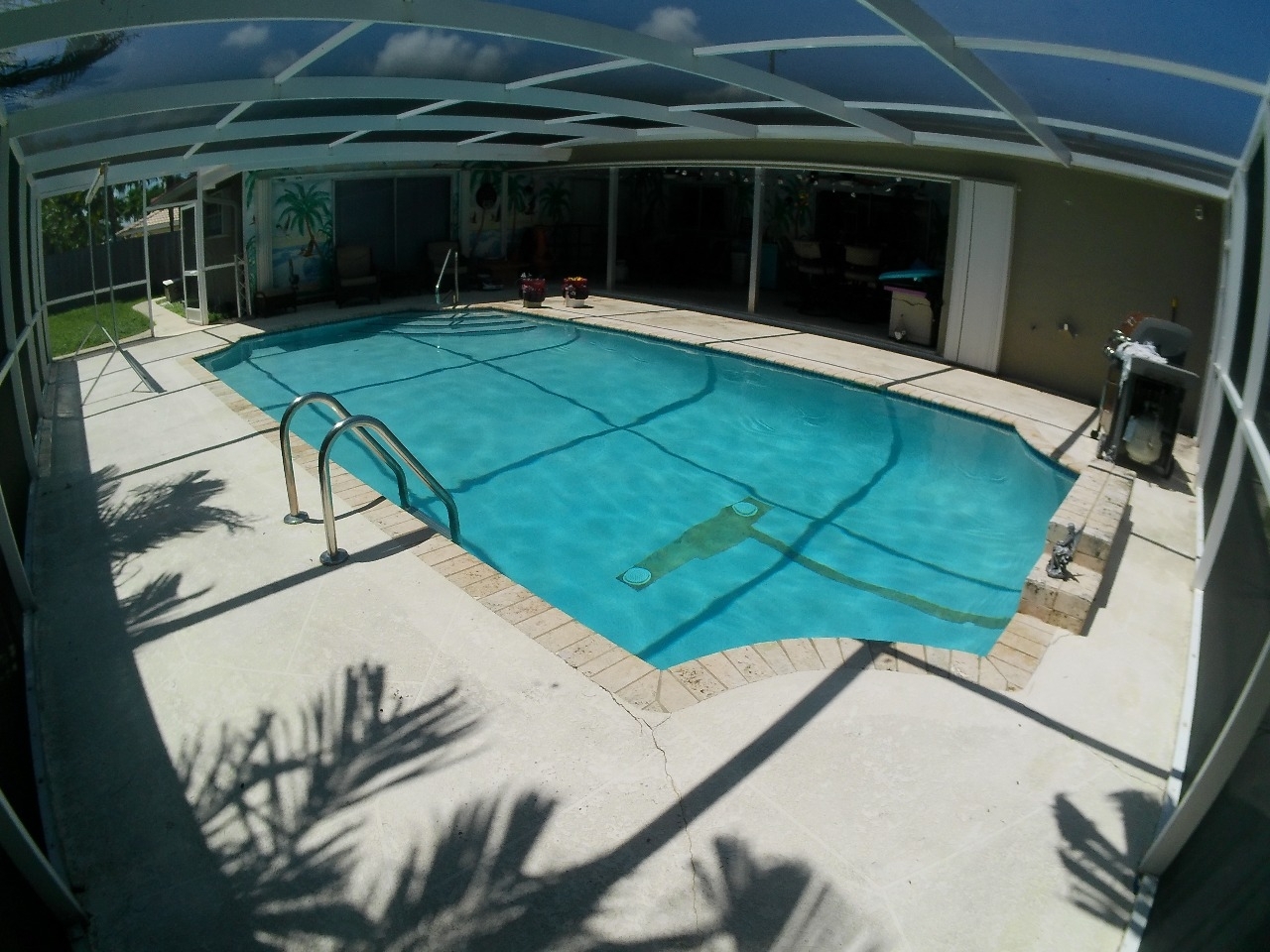 Screen-enclosed pool documented during a Lighthouse Point pool inspection